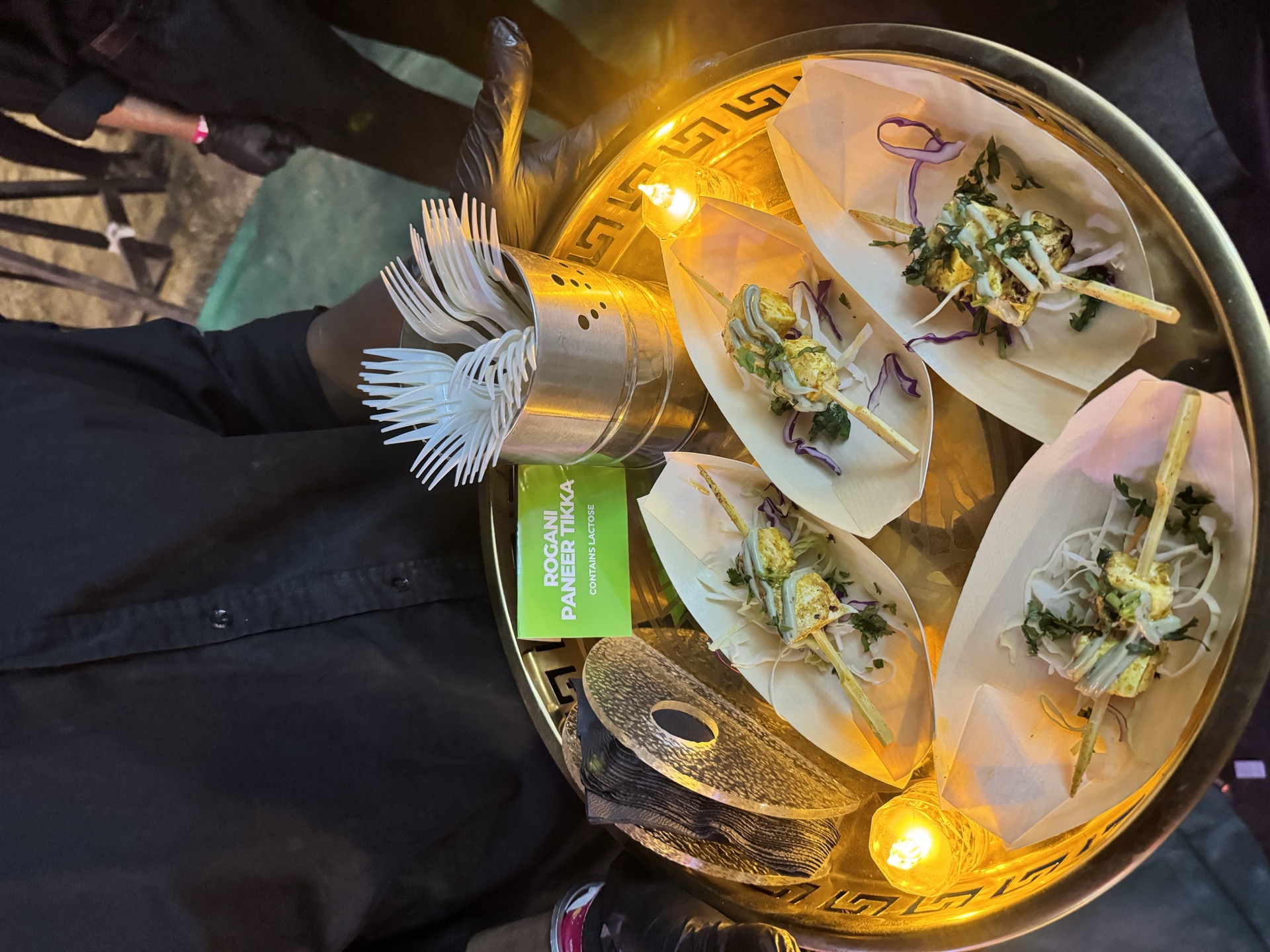 Dogani paneer tikka on gold service tray